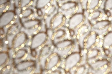 Soyut doku. Altın renkli dairesel parlak çizgiler.