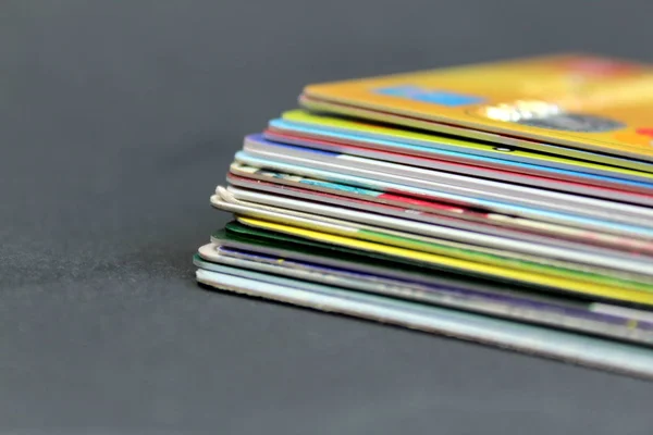 Stack of credit plastic cards on a black background