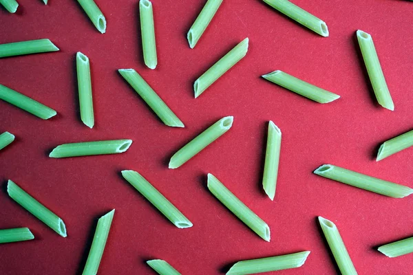 Texture Pasta Form Pen Red Backgroun — Stock Photo, Image