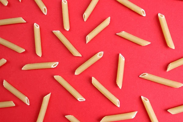 Texture Pasta Form Pen Red Backgroun — Stock Photo, Image