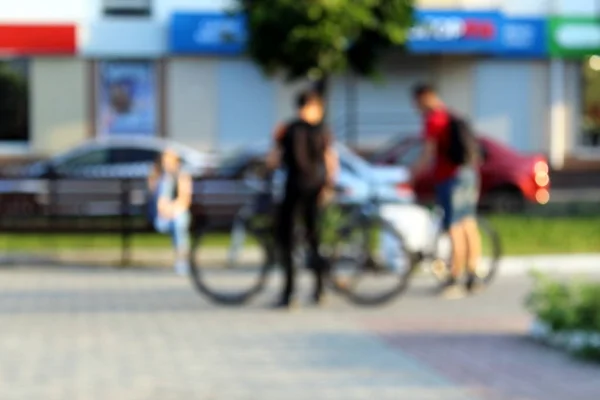 blurred background people on a bike decided to relax