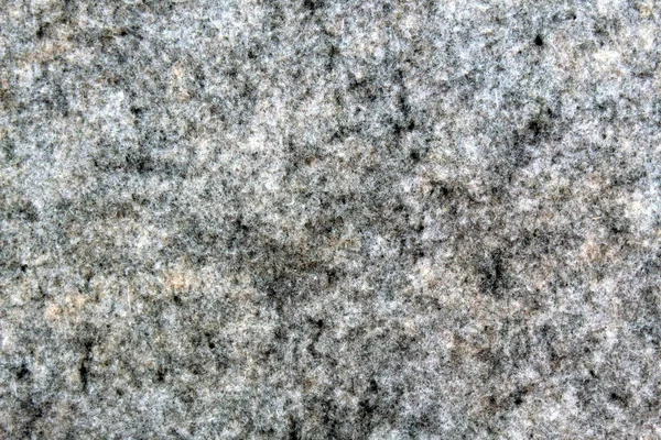 Warm and cozy gray wool surface, woolen fabric in gray closeup.