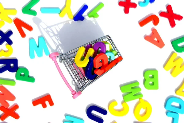 Many Bright Letters English Alphabet Shopping Cart — Stock Photo, Image