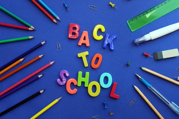 Letteren Blauw Oppervlak Terug Naar School Omringd Door Briefpapier — Stockfoto