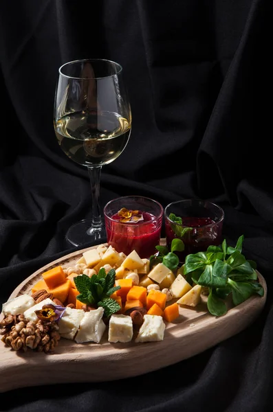 Set Various Types Cheese Cutting Board Nuts Glass Wine Dark — Stock Photo, Image