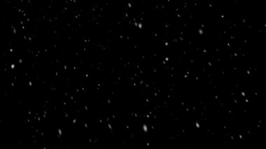 Döngü siyah arka plan üzerine düşen kar yerleşimi