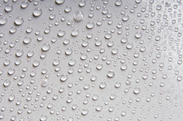 Water Drops Verschillende Maten Een Witte Achtergrond — Stockfoto