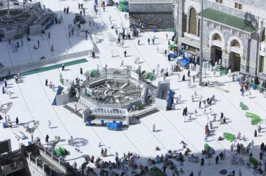 Pilgrims in Al-Masjid Al-Haram Around Al-Kaaba in Mecca, Saudi Arabia clipart