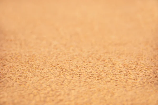 Horizontale textuur van Oranje kleine stenen top uitzicht — Stockfoto