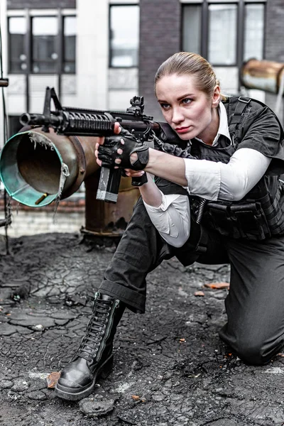 Powerful Woman Holding Gun. War Action Movie Style