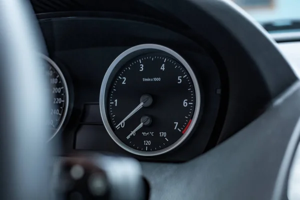 car interior. Modern car speedometer and dashboard. Luxurious car instrument cluster.