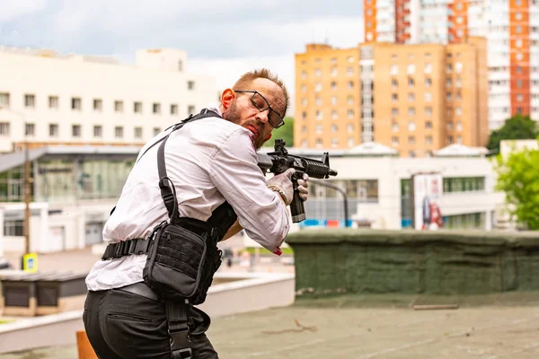 Powerful man Holding Gun. War Action Movie Style