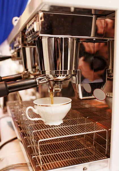 Closeup shot of coffee machine pulling a shot of espresso
