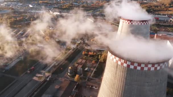 Aerial view of an industrial pipe pollutes the air next to people living in the city. Create a Greenhouse effect. Warning CO2. — Stock Footage Aerial View Industrial Pipe Pollutes Air Next People Living City Royalty Free Stock Video