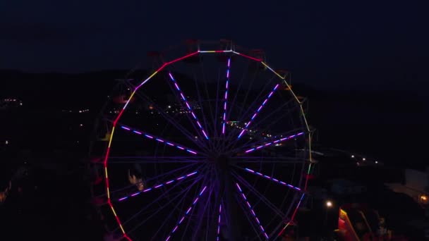 Ferris Wheel on the Background of the Sea at sunset. View from above — Stock Video