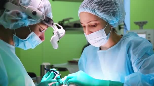 The surgeon is performing an operation on the eyes, close-up. Correction of. The doctor does blepharoplasty. Operation in the operating room. — Stock Video