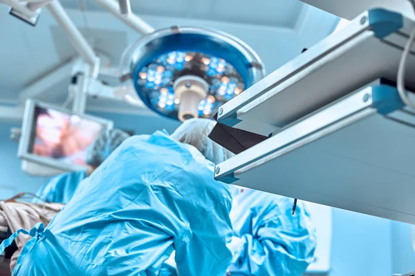 Surgery, medicine and people concept - group of surgeons at operation in operating room at hospital — Stock Photo, Image