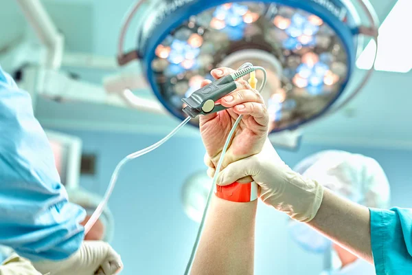 Surgery, medicine and people concept - group of surgeons at operation in operating room at hospital — Stock Photo, Image