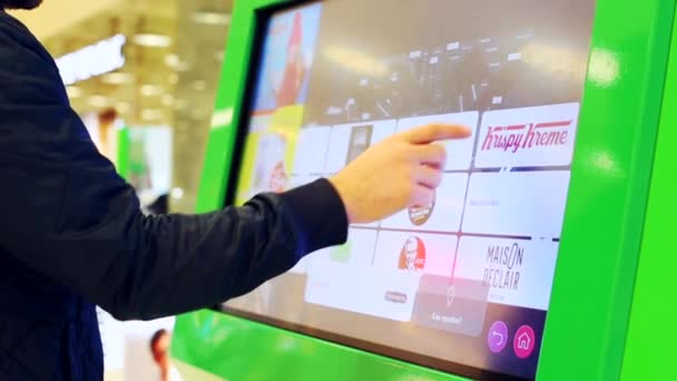 APRL 12, 2019 MOSCOW, RUSSIA: Interactive shopping mall map sign for visitors. Megapolis Shopping Mall, Moscow. A man does a search on an interactive map in the mall. — Stock Video