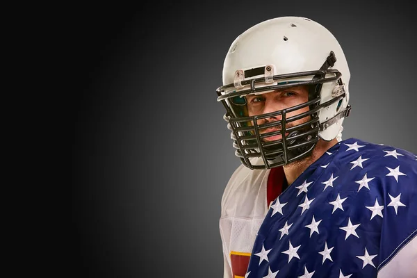 american Football Player with uniform and american flag proud of his country, on a white background.