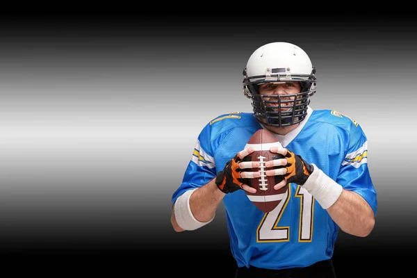 Concept american football, portrait of american football player in helmet with patriotic look. Black white background, copy space.