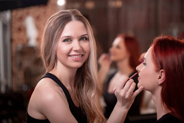 Closeup Of Beautiful Young Woman Face With Beauty Makeup, Fresh Soft Skin And Long Black Thick Eyelashes Applying Mascara With Cosmetic Brush. Make-up And Cosmetics Concept. High Resolution