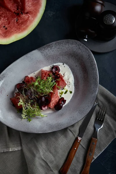 Summer salad made of watermelon, strachatella cheese, fresh mint leaves and micro greens. Top view with copy space. — Stock Photo, Image