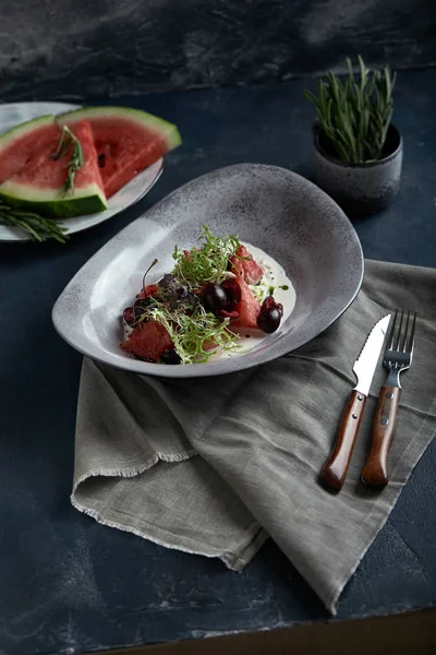 Summer salad made of watermelon, strachatella cheese, fresh mint leaves and micro greens. Top view with copy space. — Stock Photo, Image