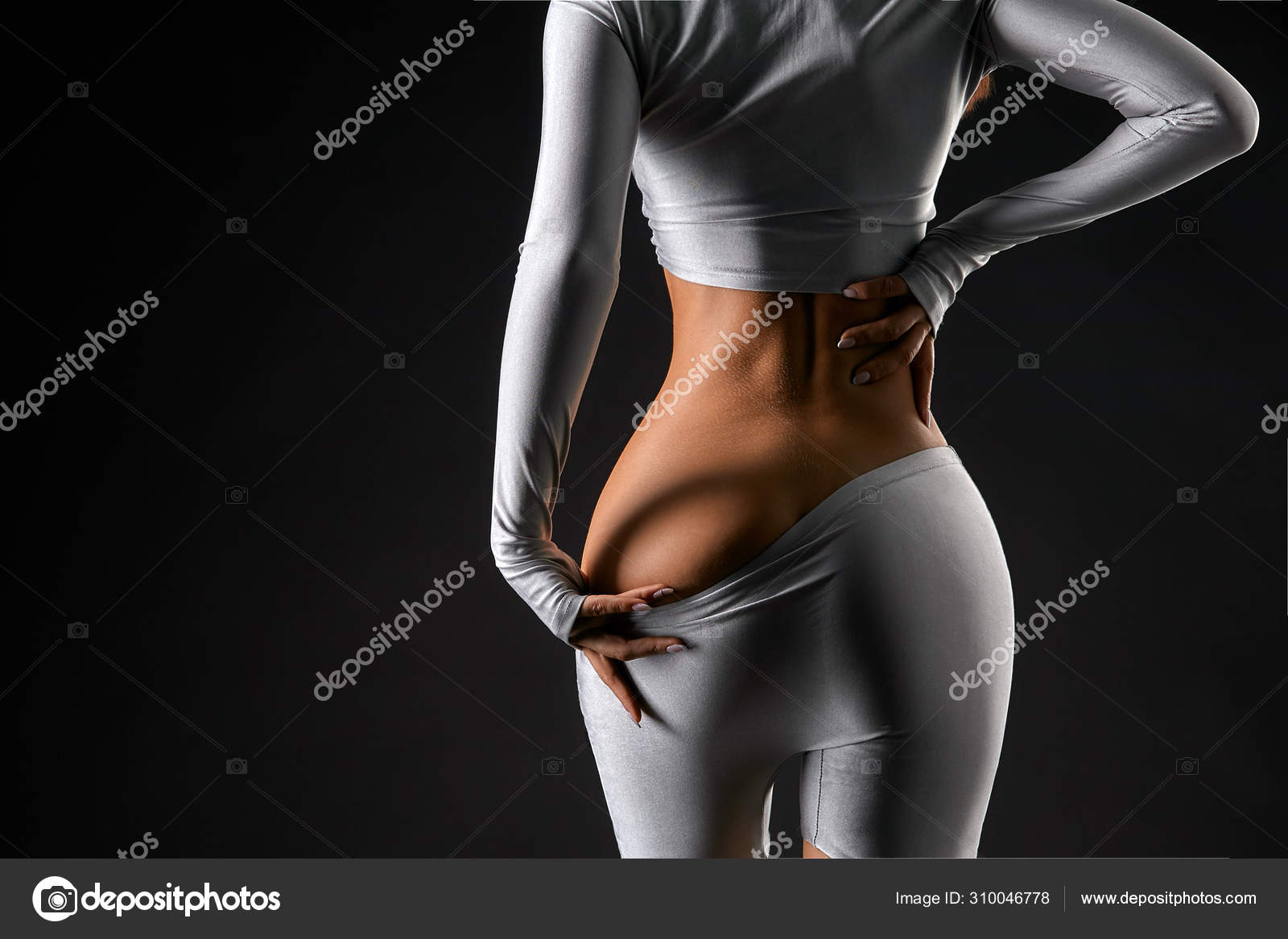 Rear view of female hands taking off pants showing sexy ass Stock Photo by  ©Gerain0812 310046778
