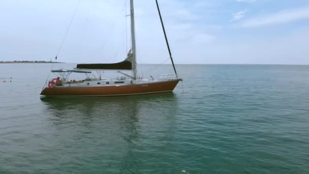 Yacht sailing on opened sea. Sailing boat. Yacht from drone. Yachting video. Yacht from above. Sailboat from drone. Sailing video. Yachting at windy day. Yacht. Sailboat. — Stock Video