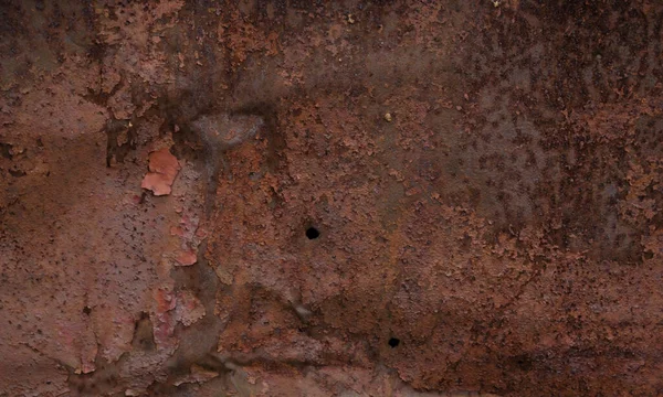 Paslanmış ve oksitlenmiş arka plan. Eski demir panel. Metal plaka üzerinde koyu kırmızı, kahverengi ve siyah pas. Grunge paslanmış metal soyut dokusu. Paslı metal duvar. Paslı paslı metal yüzey..
