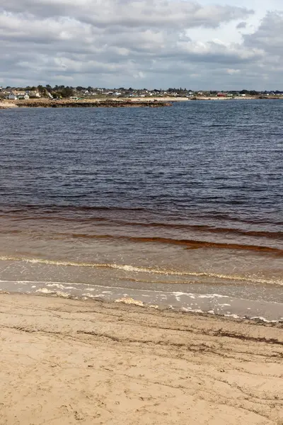 Beach with sand and buildings in Galway Bay — Stock Photo, Image