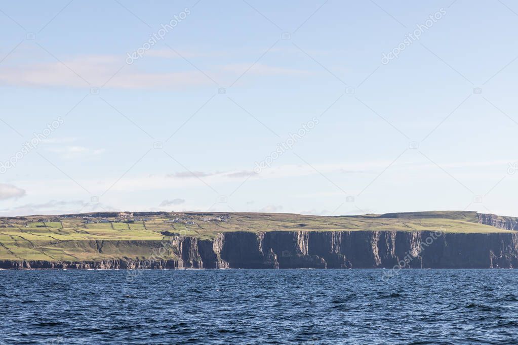 Farm fields and houses over Cliffs of Moher