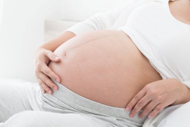 Kasılmalar mide hamile kadınların