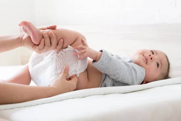 Mother Put Diaper Her Son — Stock Photo, Image