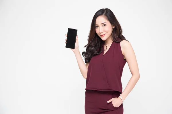 Portrait of beautiful Asian wowan showing or presenting mobile phone application on hand isolated over white background — Stock Photo, Image