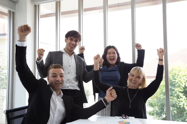 Successful startup entrepreneurs and business people team achieving goals celebrating giving high five in office. Success and winning concept — Stock Photo, Image