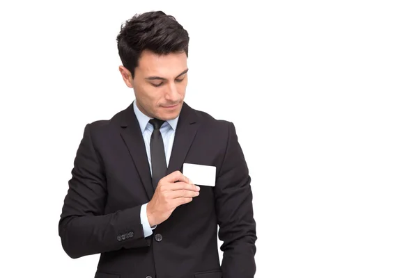 Handsome businessman in suit with business card isolated over white background — Stock Photo, Image