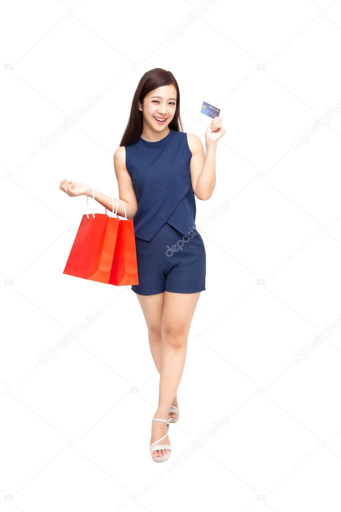 Happy Asian woman holding credit card or cash advances and shopping bag, Pay instead of money and specially curated benefits for lady card concept