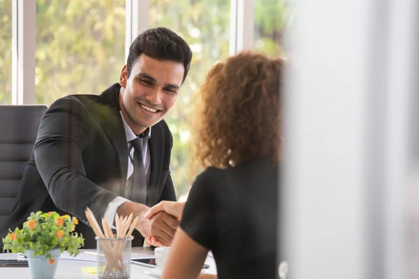 Recruitment officers shaking hand with candidate arrived for job