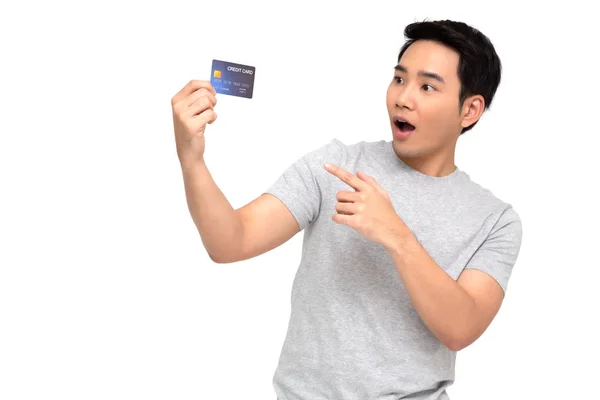 Asian man with wow face and showing credit card on hand isolated on white background — Stock Photo, Image