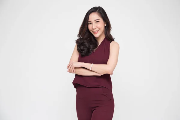 Portrait of successful business asian women in dark red dress with arms crossed and smile isolated over white background — Stock Photo, Image