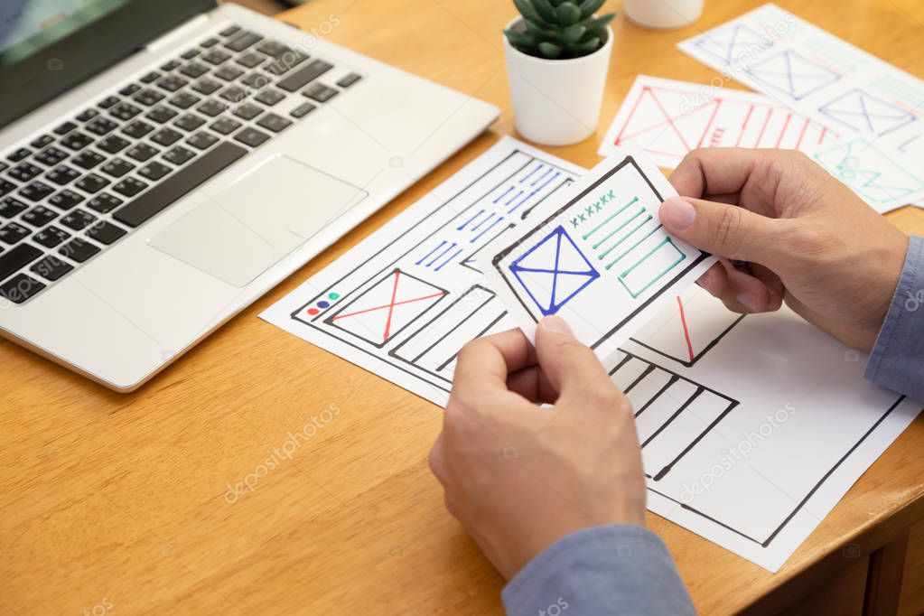 UI Graphic designer creative sketch and planning prototype wireframe for website. Web application development of user interface and user experience concept