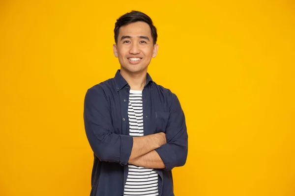 Portrait Asian Man Arms Crossed Smile Isolated Yellow Background Looking — Stock Photo, Image