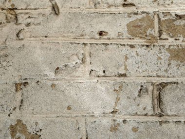 Hafif bir tuğla duvar eski serpilir alçı, doğal çevre ile bir parçası doku