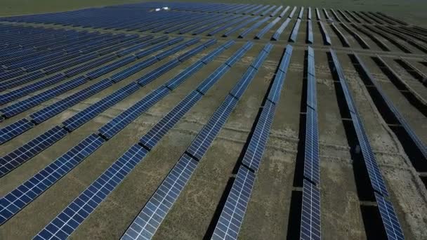 Aerial view of solar panels on meadow landscape — Stock Video