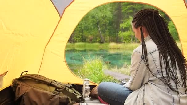 Woman relax in tent at hiking summer wild travel — Stock Video