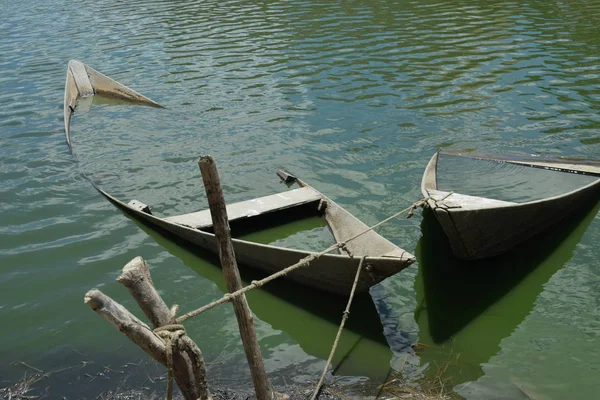 Lost wooden boats on desert lost paradise