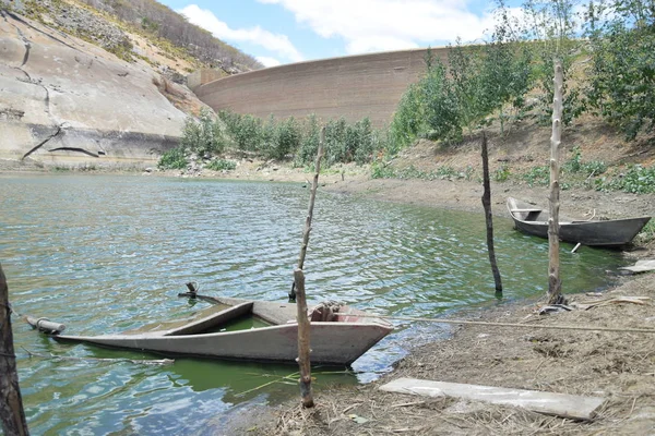 Lost wooden boats on desert lost paradise