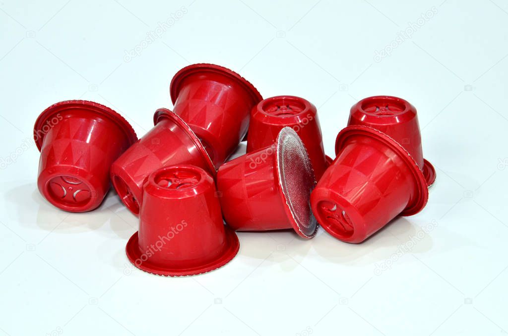 Collection of espresso coffee capsules red isolated on white background, Closeup view with details.